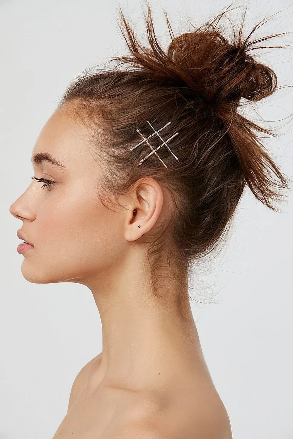 Photo showing messy top knot, with the hairstyle clearly visible.