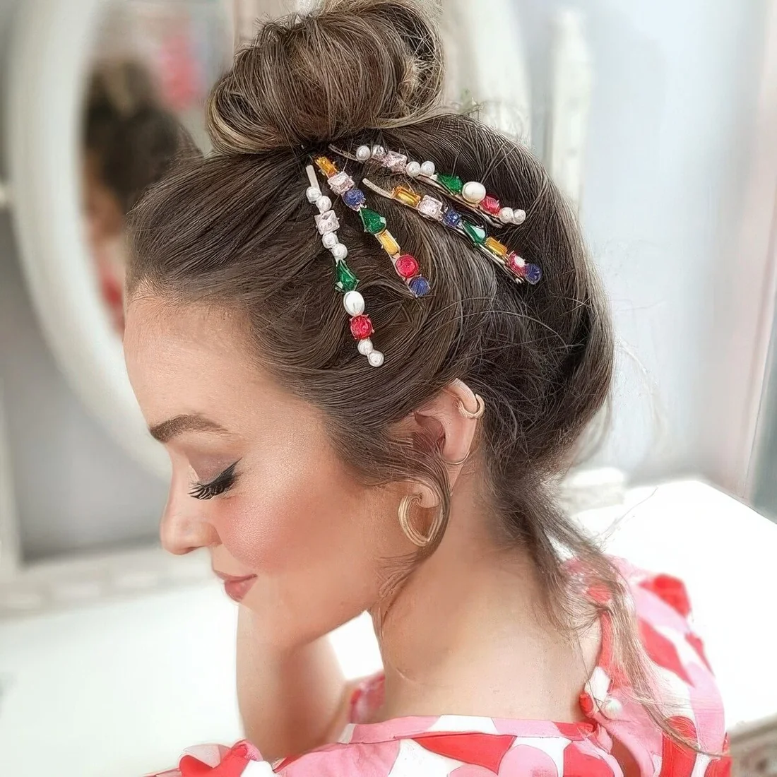 Photo showing ballerina top knot, with the hairstyle clearly visible.