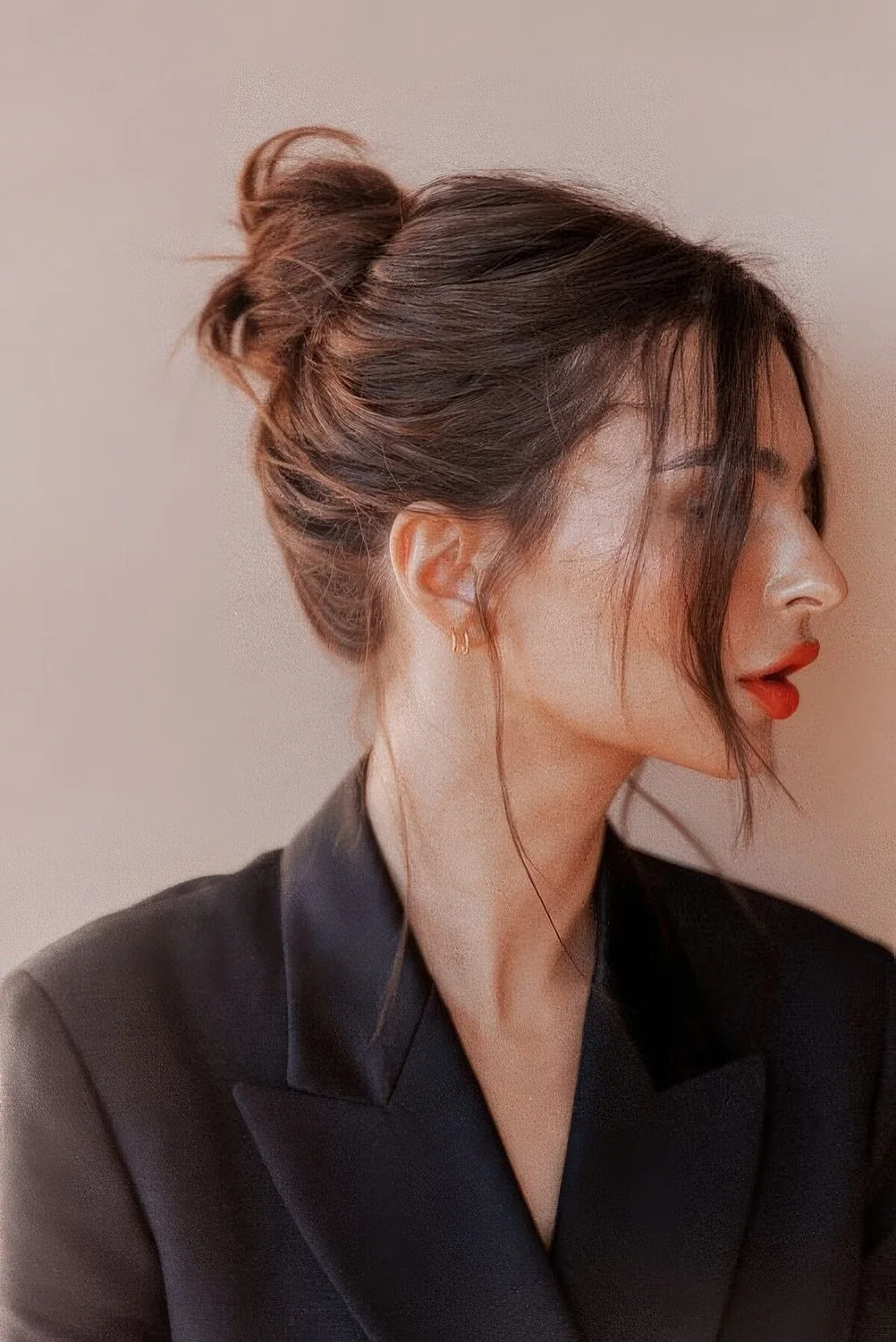 Photo showing messy ballerina bun, with the hairstyle clearly visible.