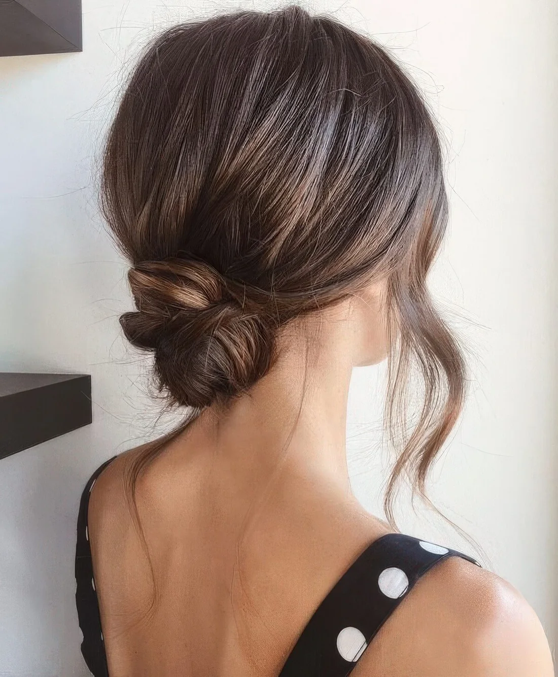 Photo showing wrapped low bun, with the hairstyle clearly visible.