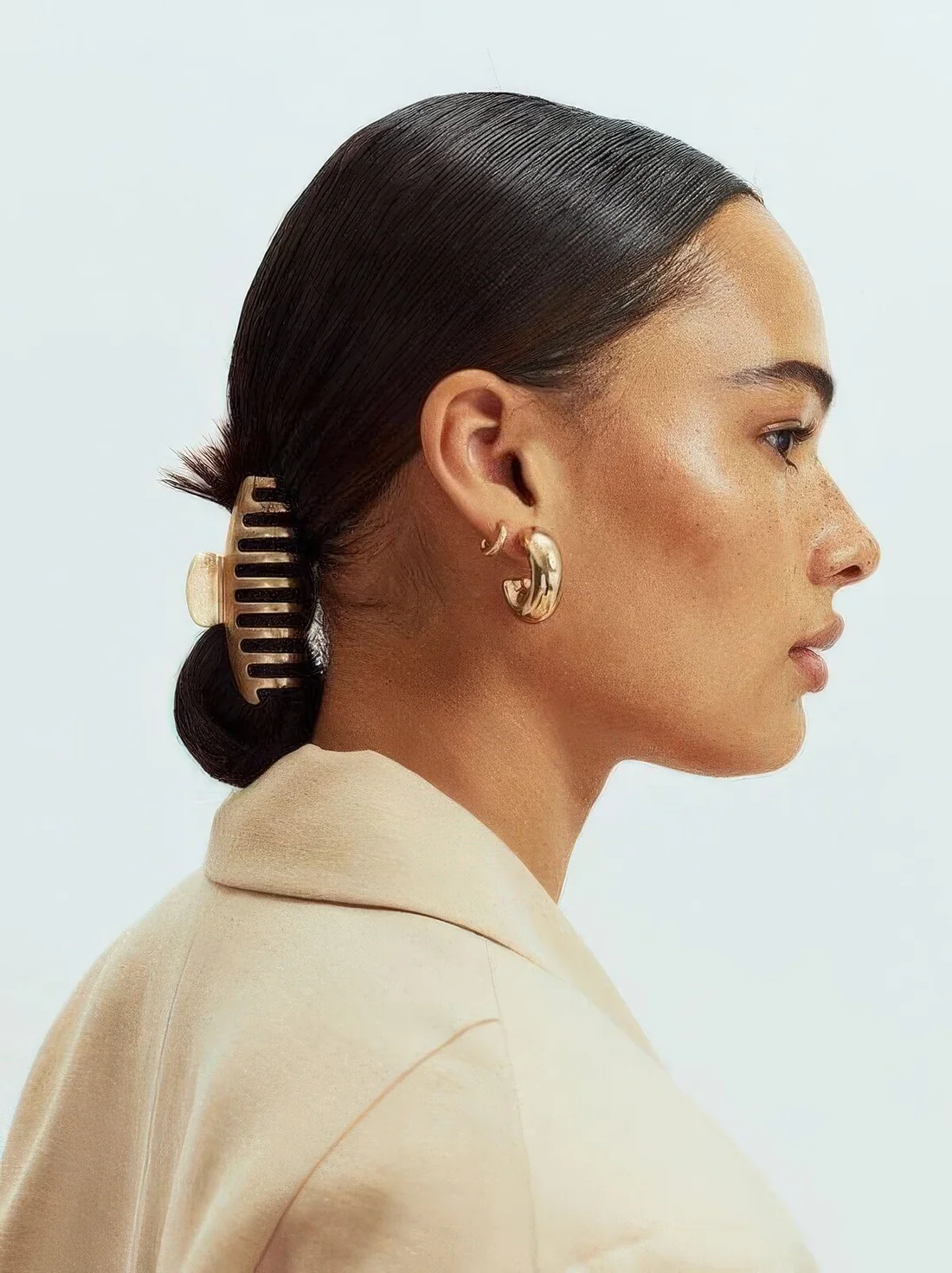 Photo showing low bun with a clip, with the hairstyle clearly visible.
