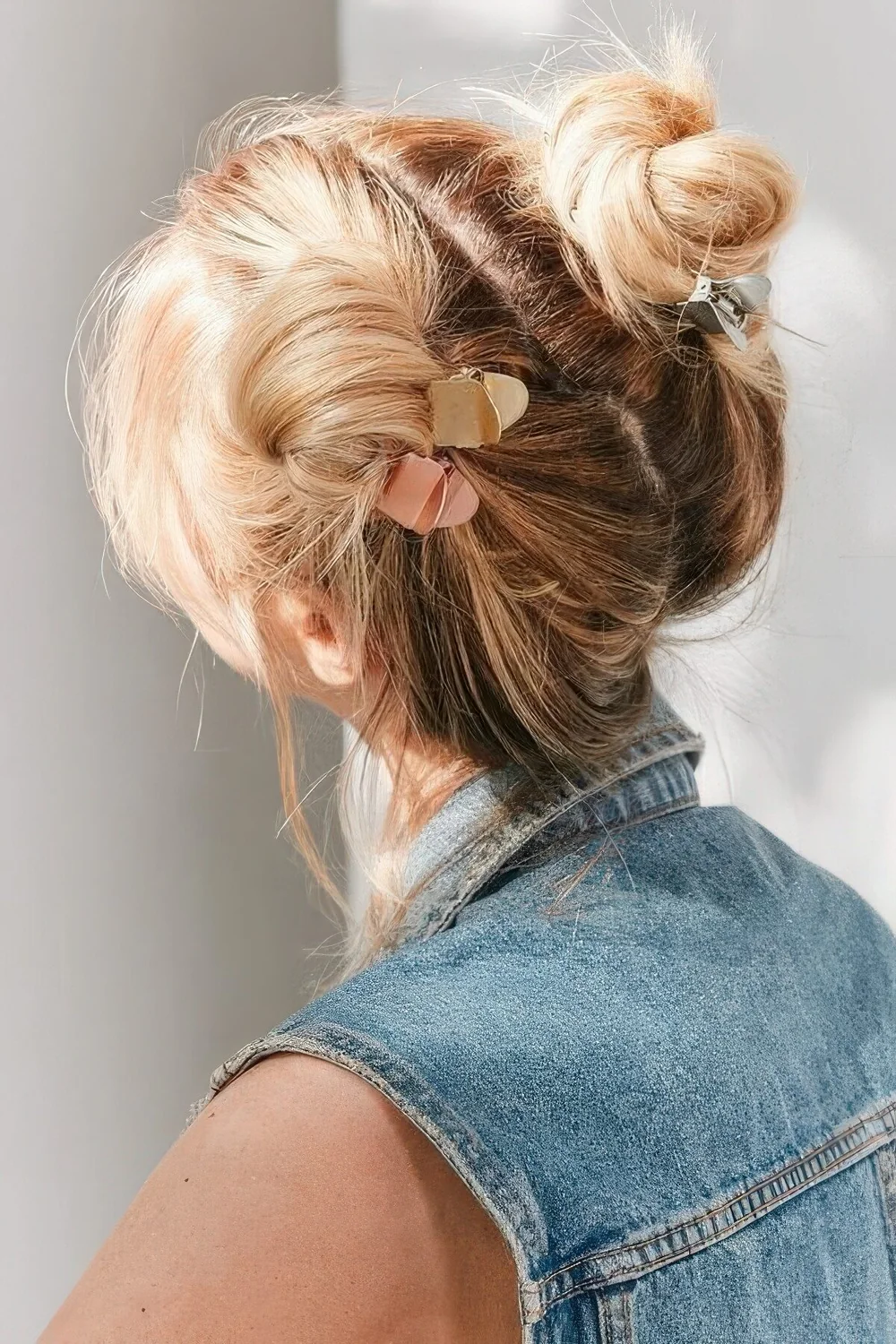 Photo showing space buns, with the hairstyle clearly visible.