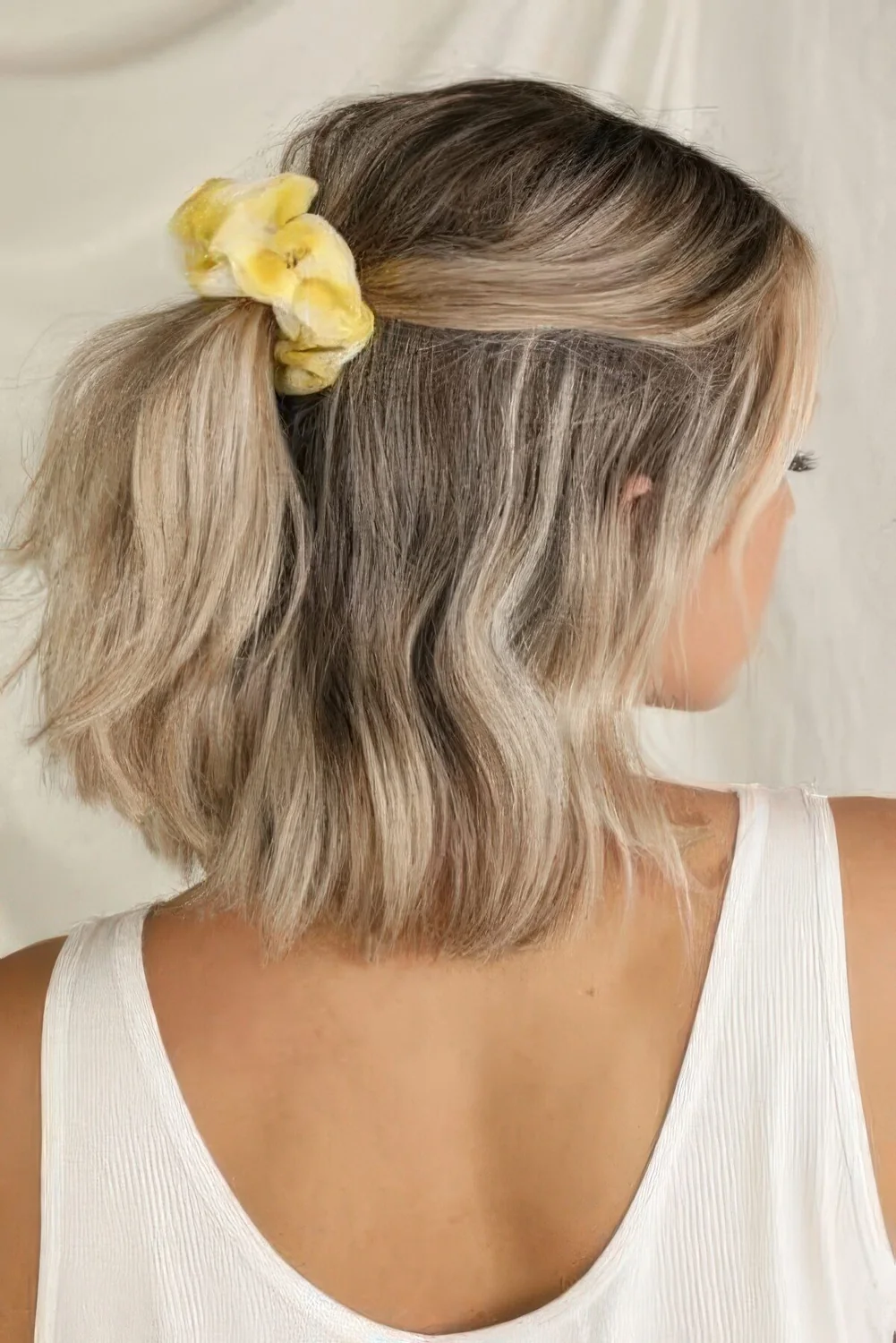 Photo showing half updo, with the hairstyle clearly visible.