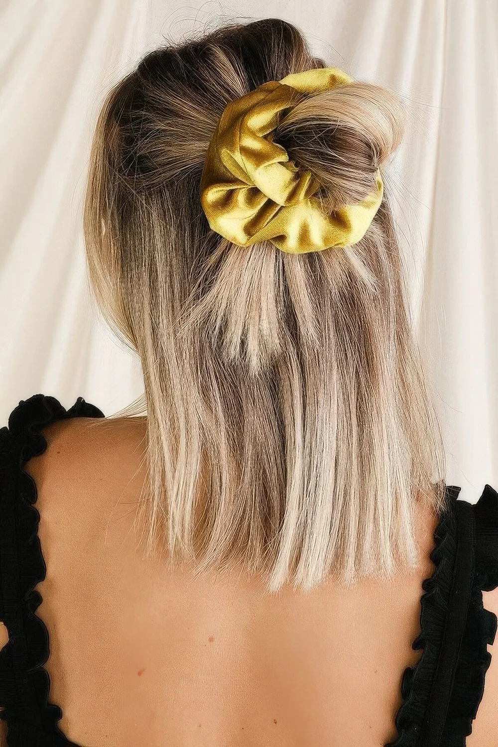 Photo showing half updo with a scrunchie, with the hairstyle clearly visible.