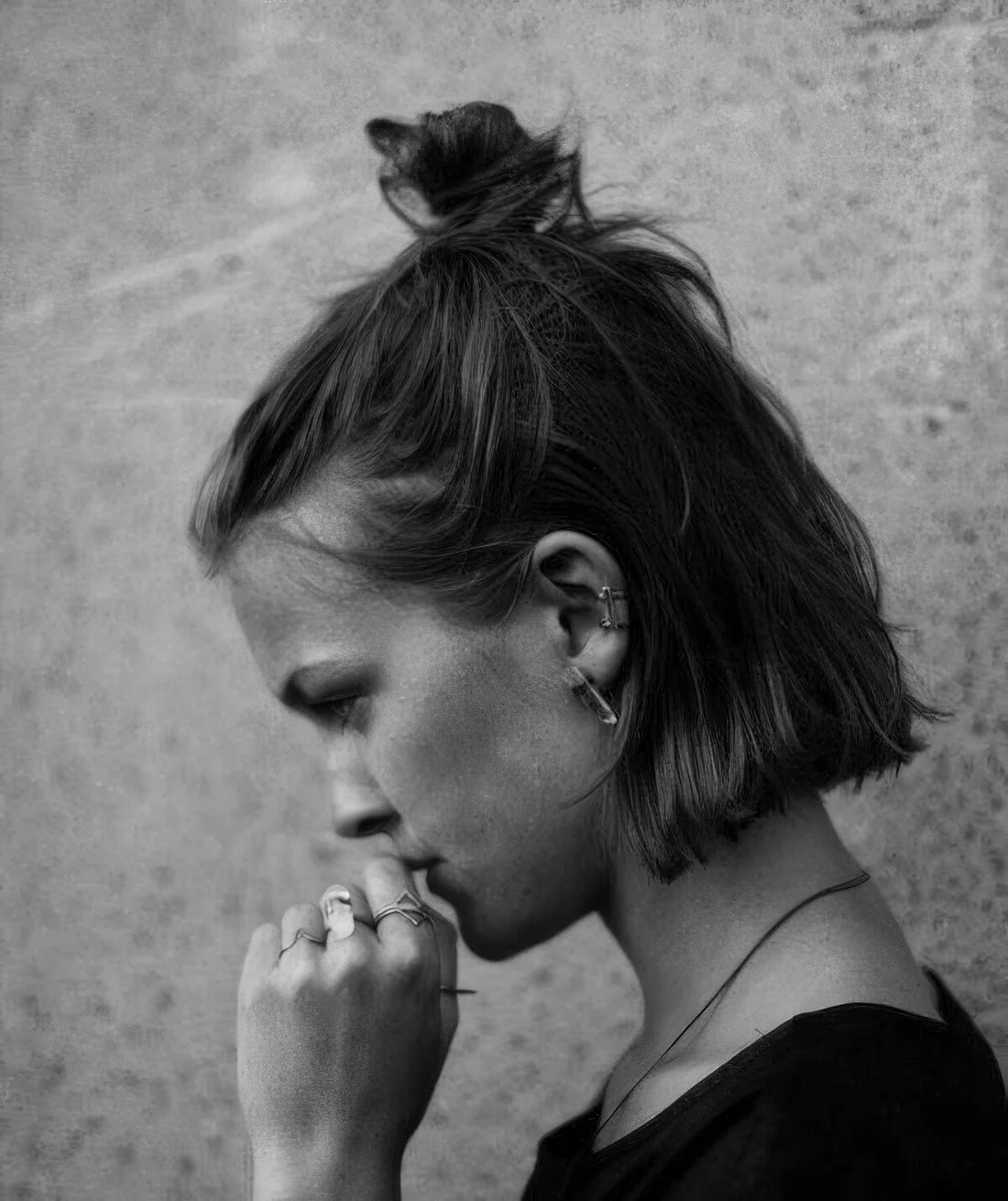 Photo showing messy top knot half updo, with the hairstyle clearly visible.