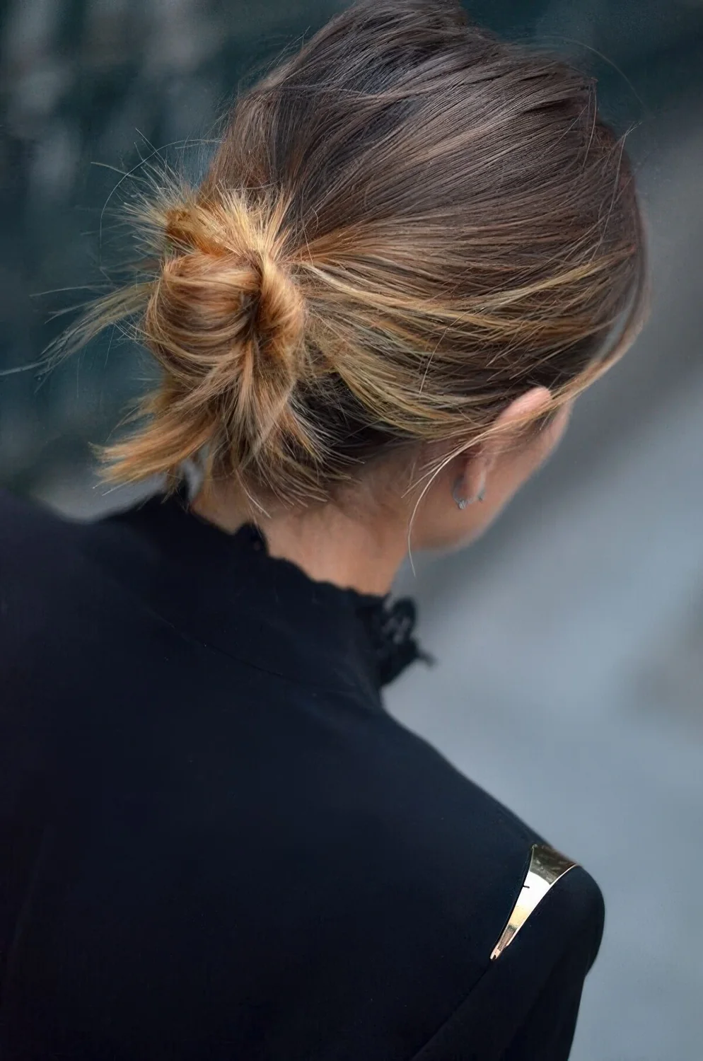 Photo showing messy wrapped chignon, with the hairstyle clearly visible.