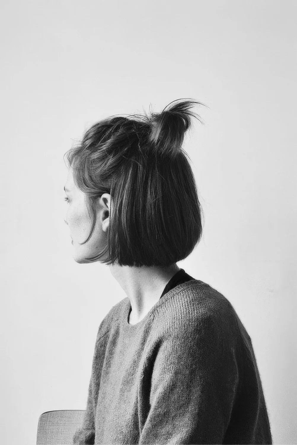 Photo showing small ponytail half updo, with the hairstyle clearly visible.