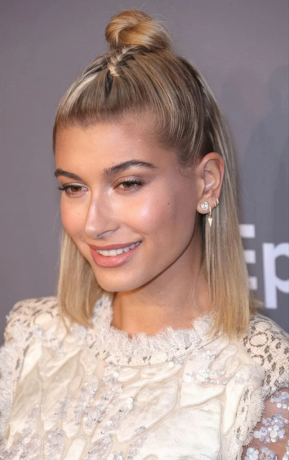 Photo showing top knot and a braid, with the hairstyle clearly visible.