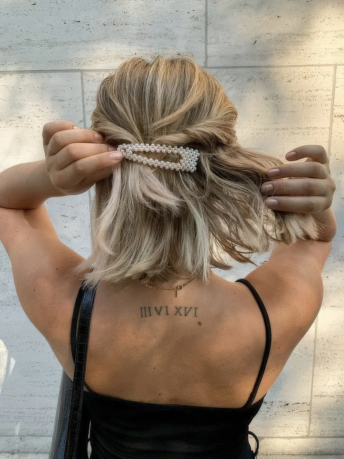 Photo showing twisted half updo, with the hairstyle clearly visible.