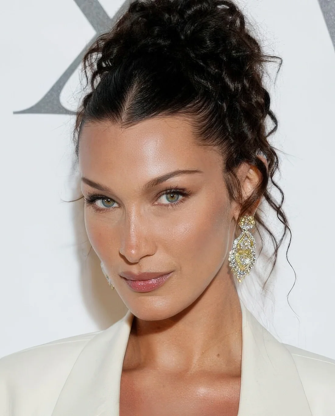 Photo showing curly high ponytail, with the hairstyle clearly visible.