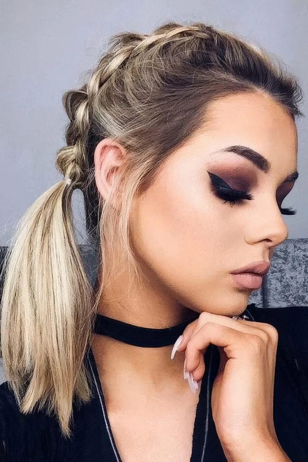 Photo showing french braids into tails, with the hairstyle clearly visible.