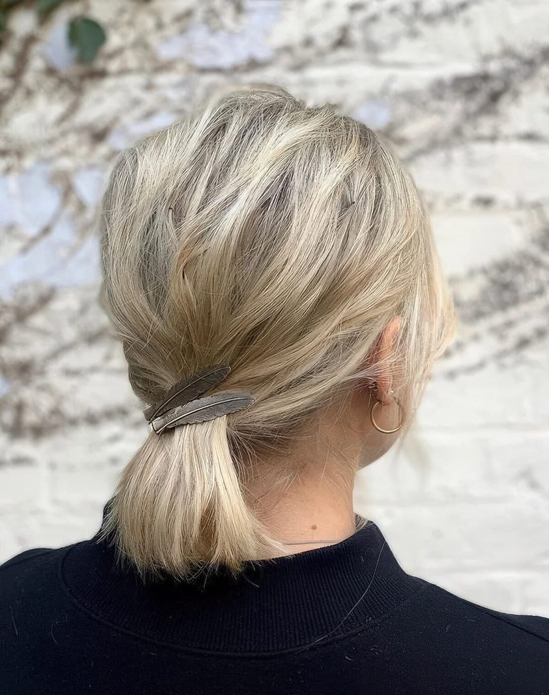 Photo showing low ponytail with clips, with the hairstyle clearly visible.
