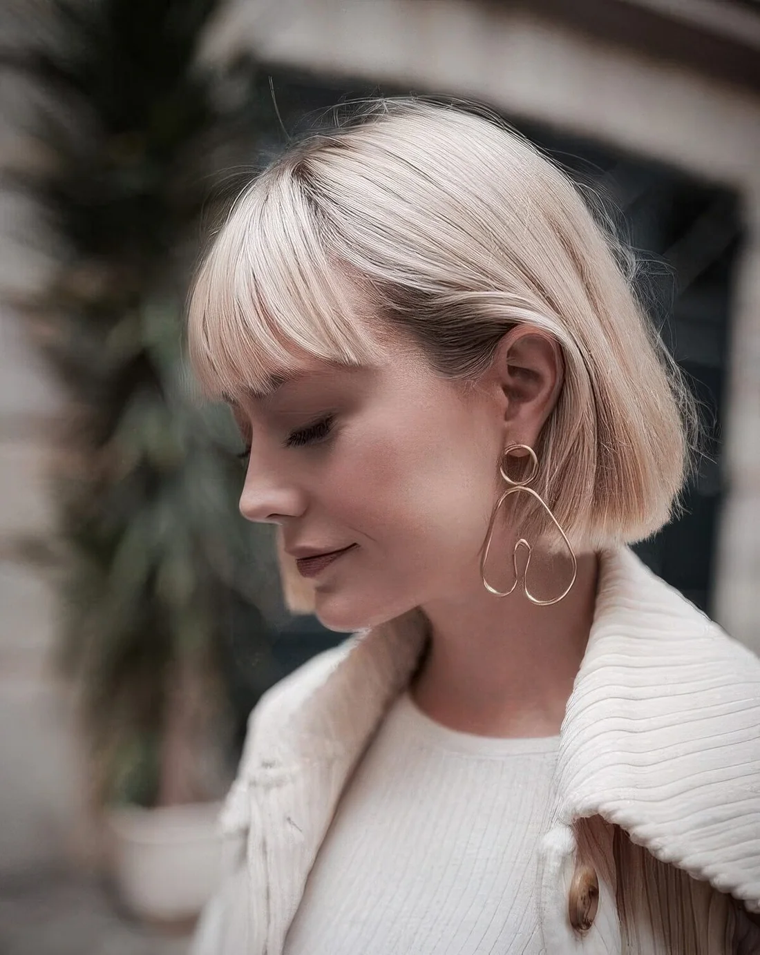 Short blonde bob with classic bangs always.