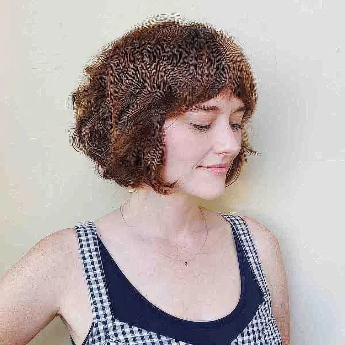 Ginger French bob with bottleneck bangs.
