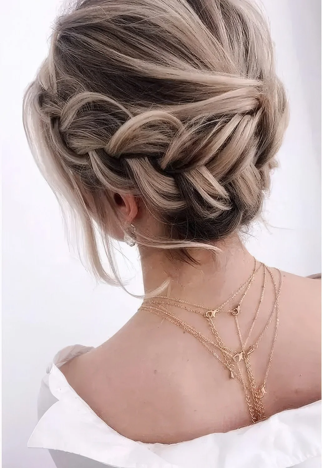 French braid halo low updo with a volume on top, some waves down.