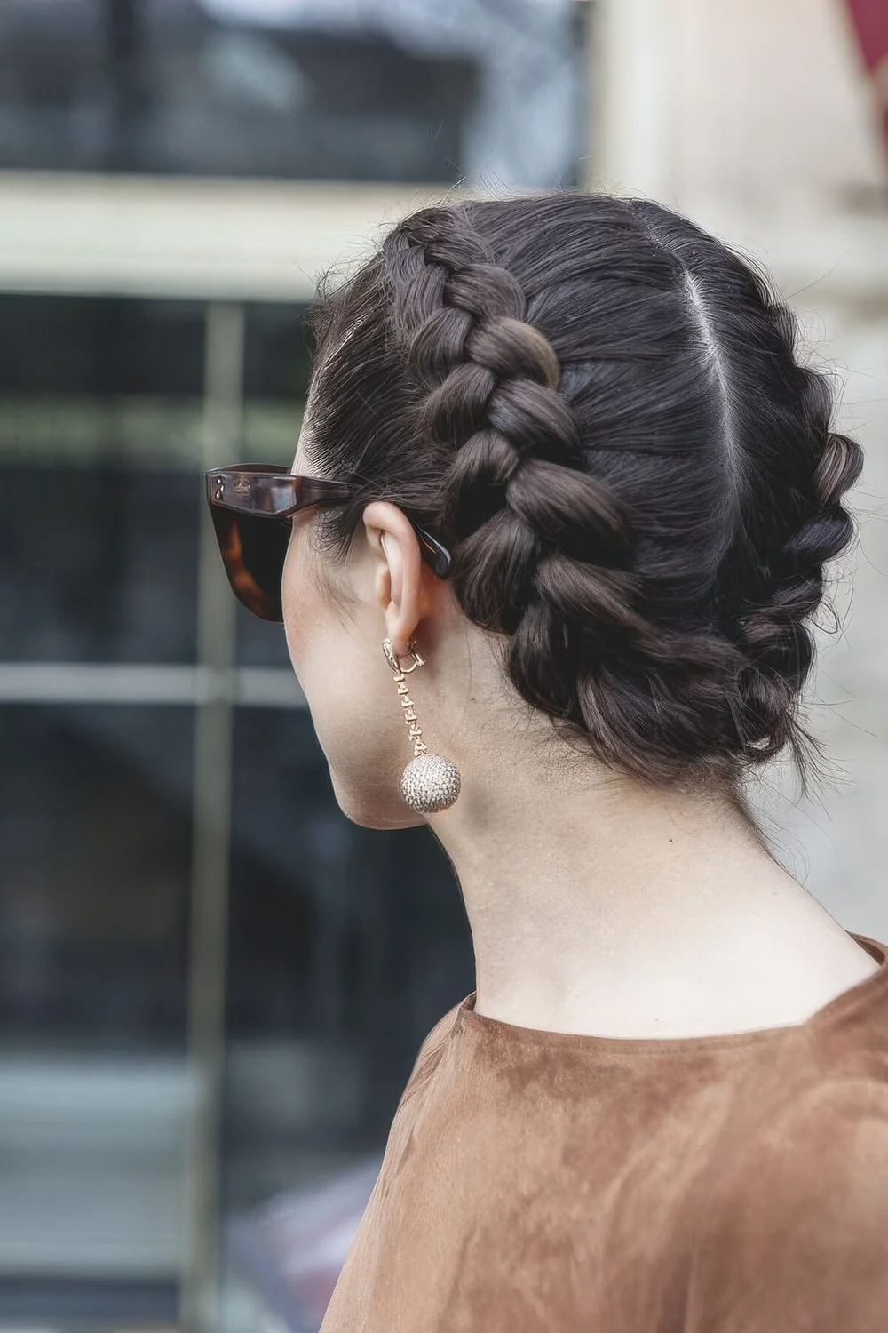 Photo showing double French braid updo, with the hairstyle clearly visible.