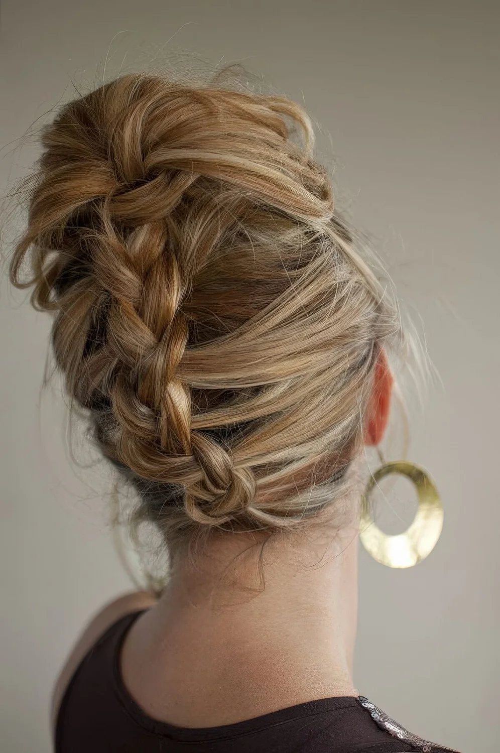 Medium hair updo with a back French braid and some waves on top.