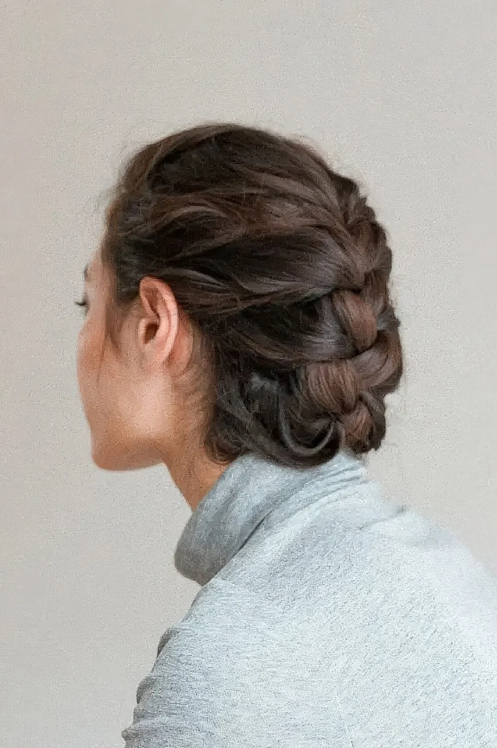 Simple French braided low updo with a bump on top.