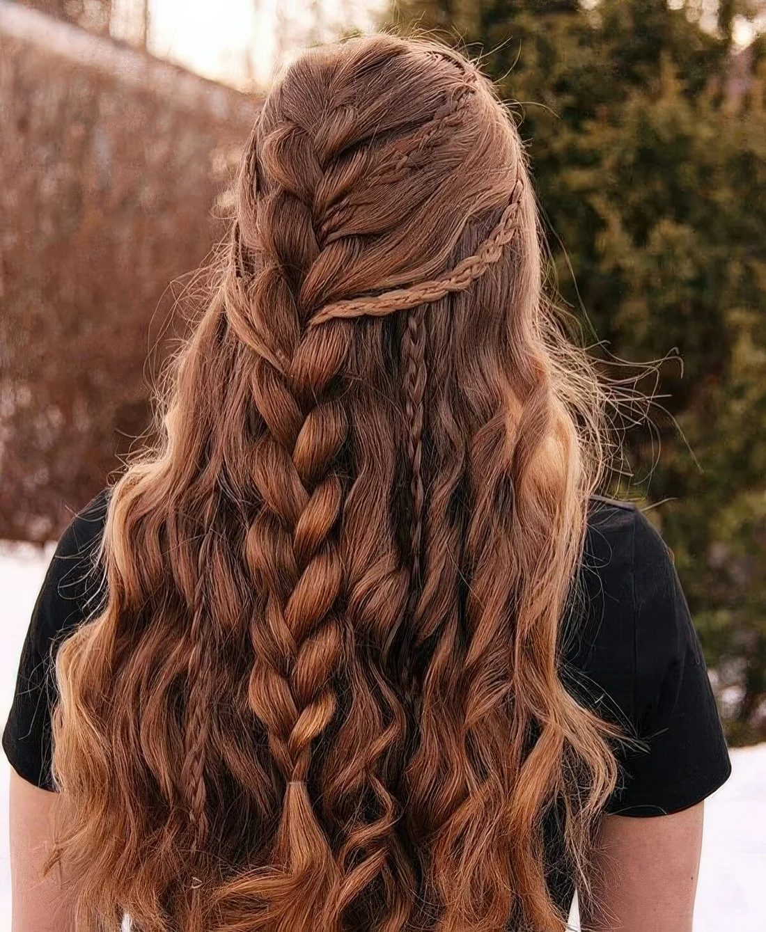 Viking style half updo with a whole ton of French braids and waves down.