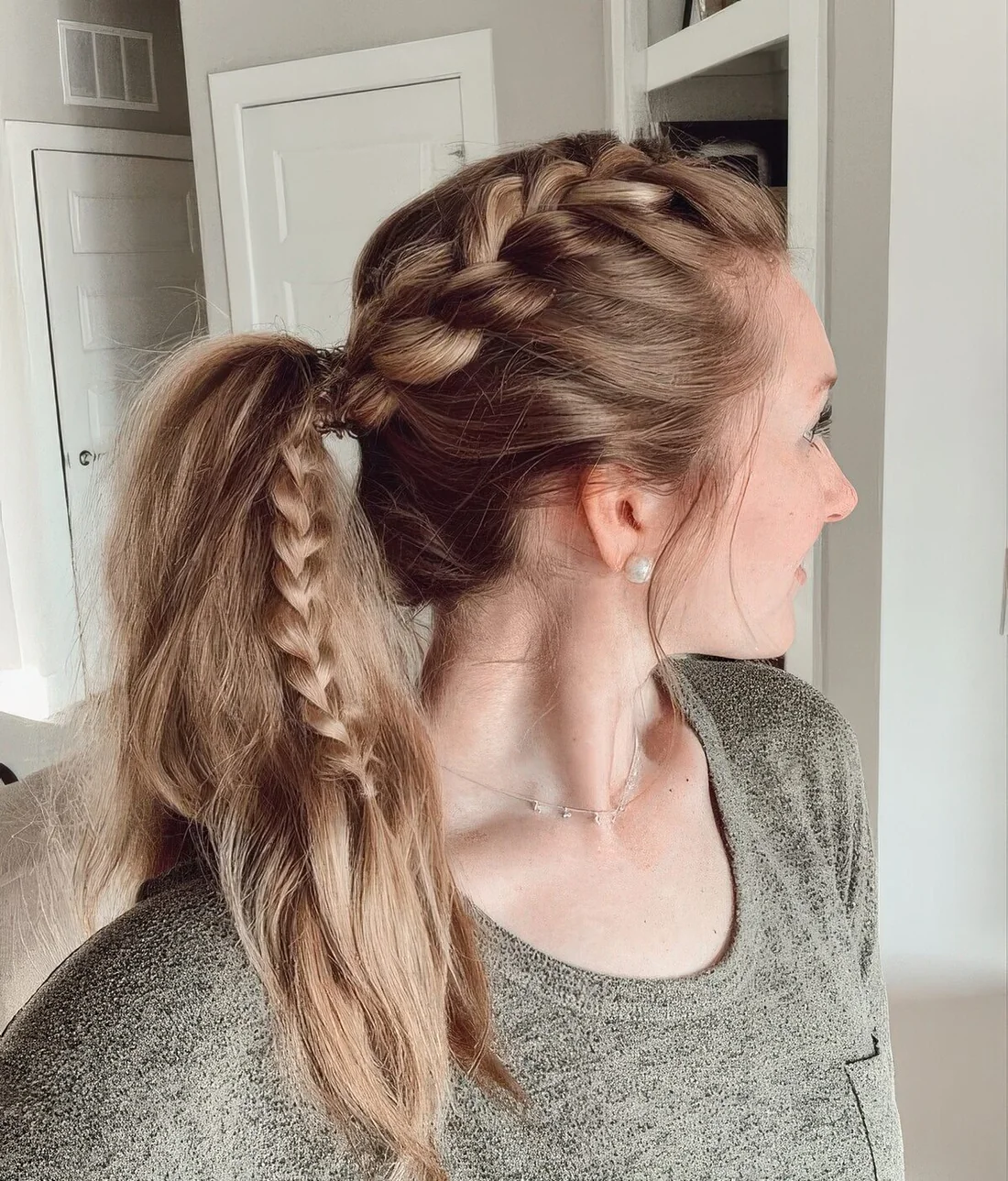 Side French braid into a high ponytail.