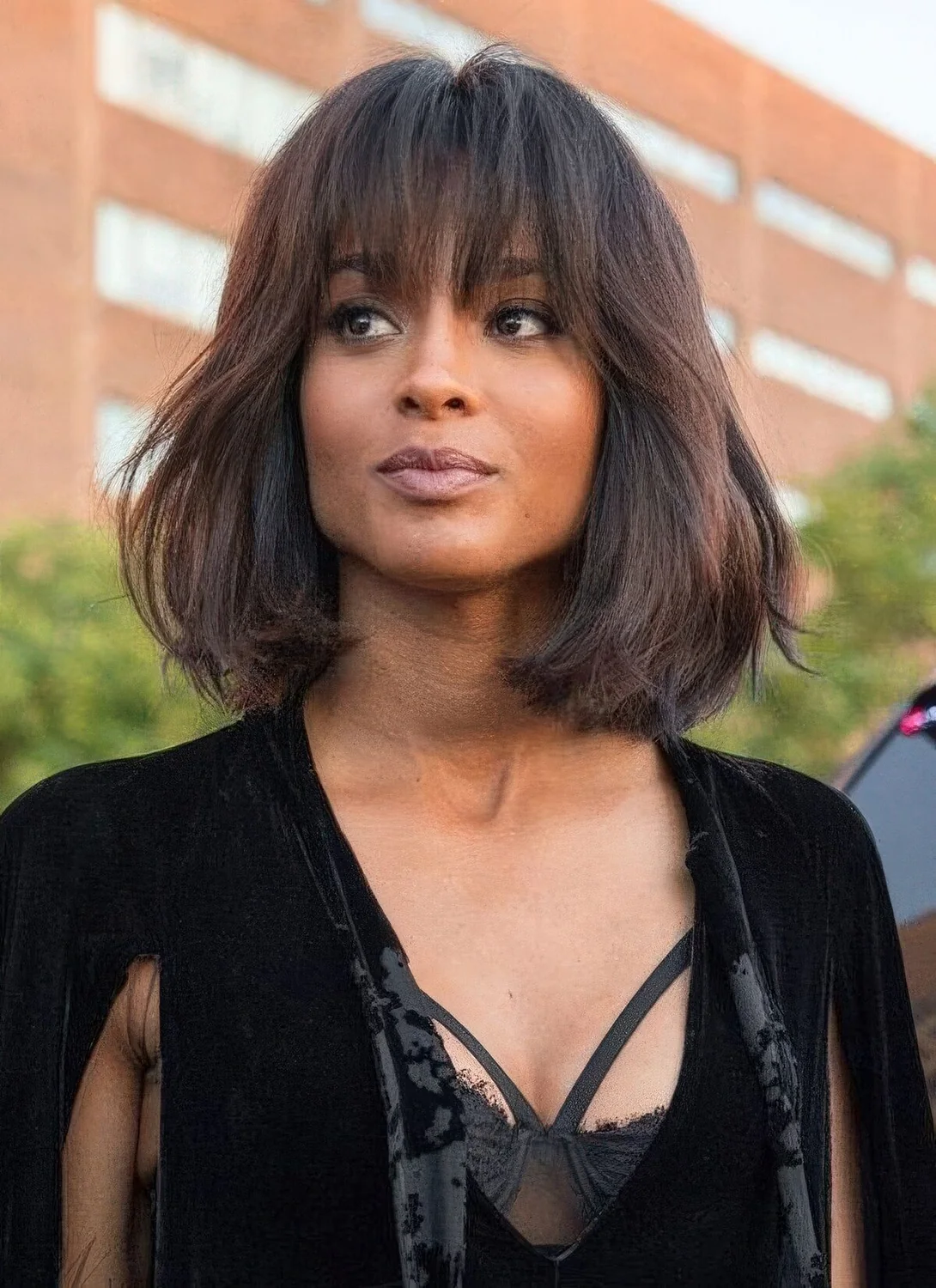 Deep brown long bob with texture and overgrown frigne bangs to make a girlish statement.