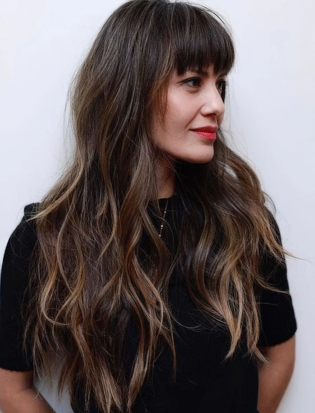 Photo showing layered hairstyle for long hair, with the hairstyle clearly visible.