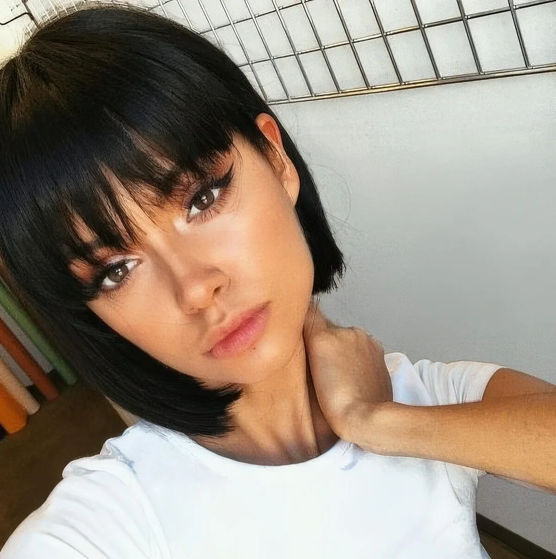 Black boy bob with fringe bangs for a super cute, doll like look.