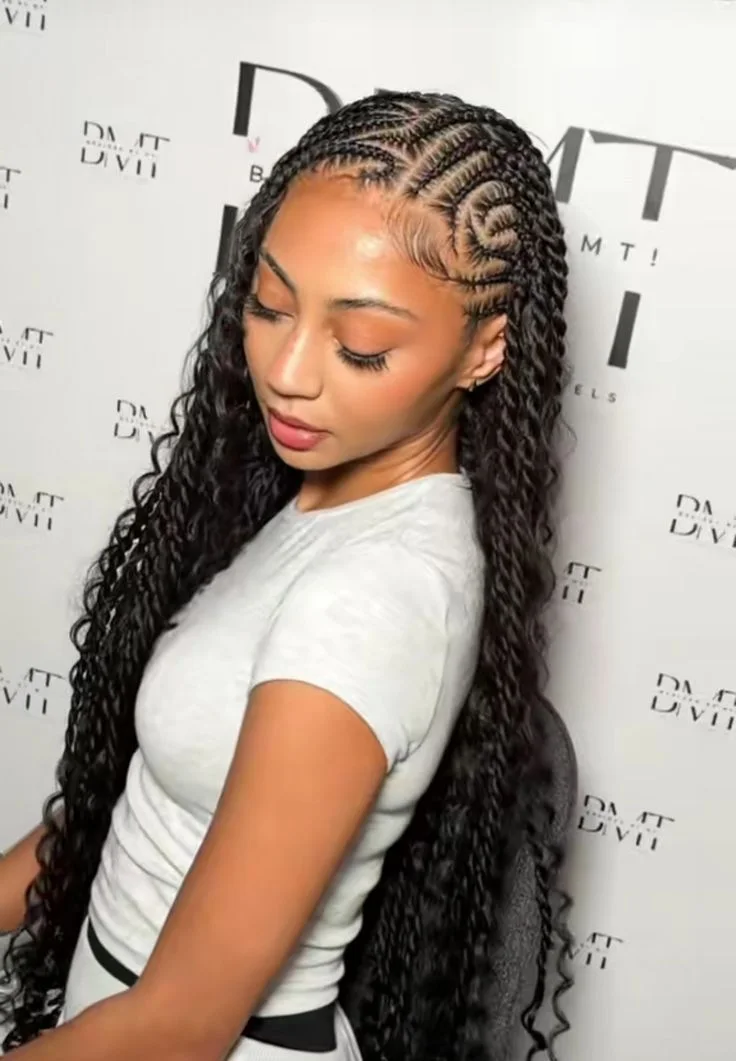 Black woman with long Fulani braids, a curved cornrow pattern, and defined edges