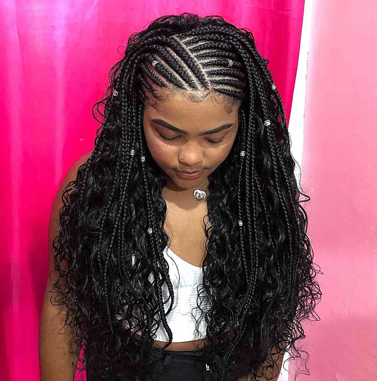 chest braids black knotless shown as a fulani braids idea, featuring braids texture, shown in black woman cornrows with curly ends for fulani braids