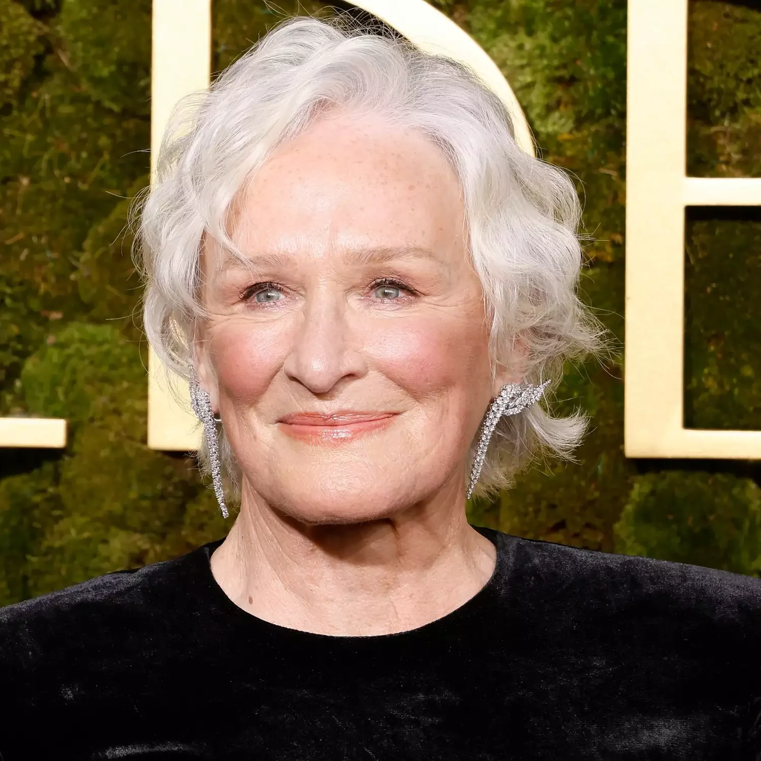 shoulder wavy silver updo shown as a gray blending for older women idea