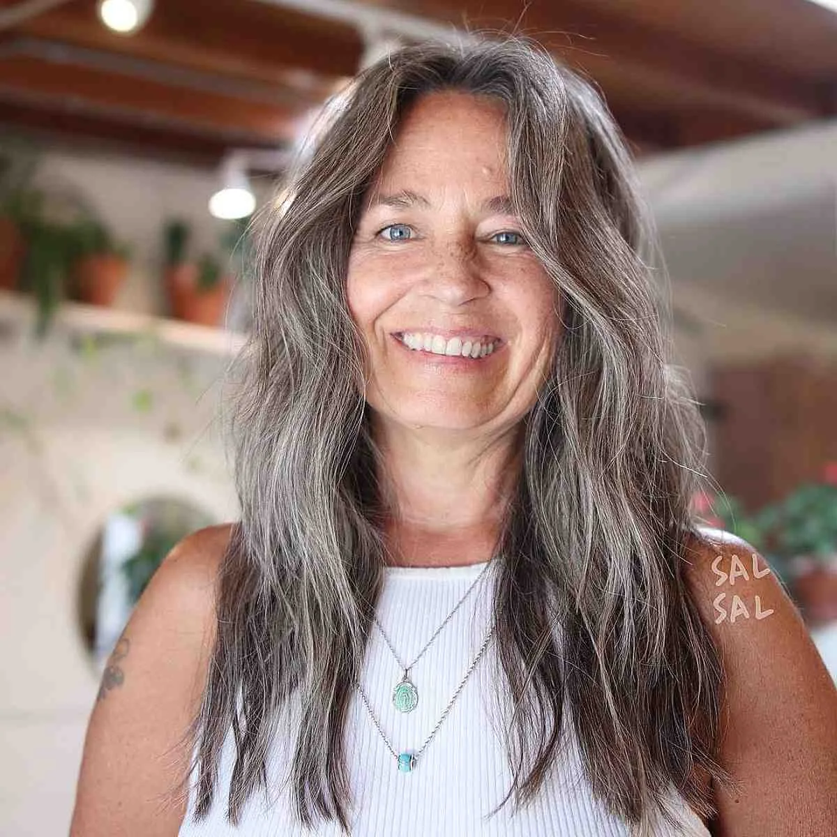 chest wavy gray layers shown as a gray blending for older women idea, featuring medium layering