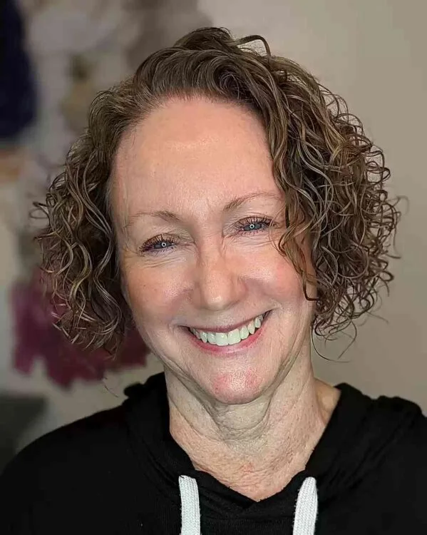 ear curly chestnut curly bob with curly fringe fringe shown as a gray blending for older women idea