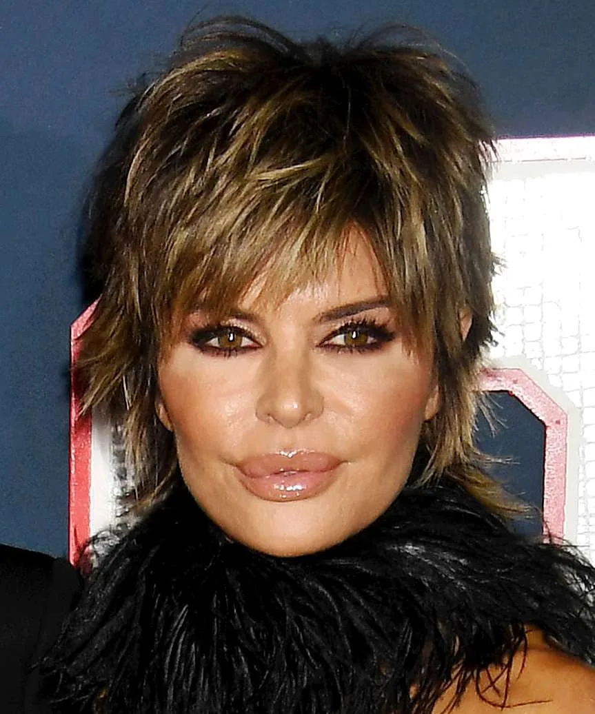 short straight caramel shag with wispy fringe shown as a haircuts for women over 50 idea