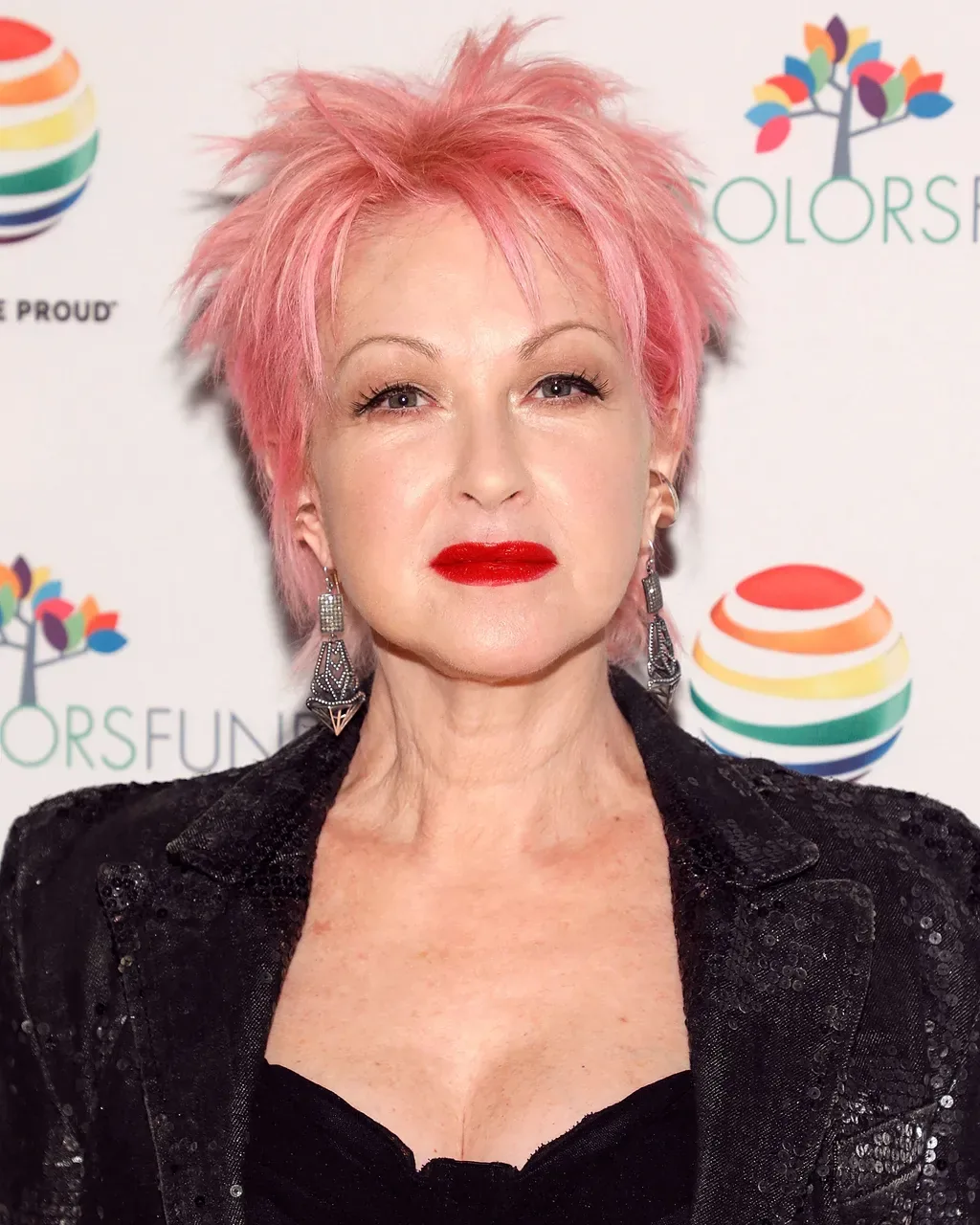 ear straight pink pixie with wispy fringe shown as a haircuts for women over 50 idea