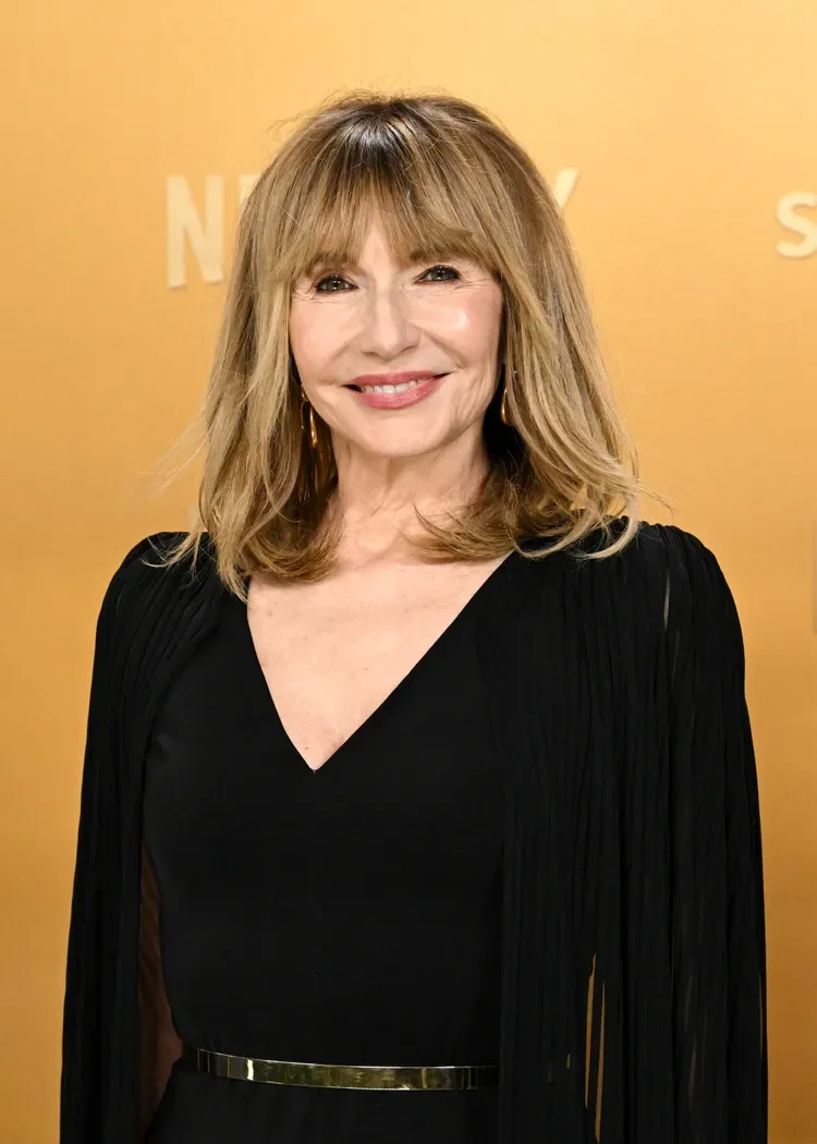 chest wavy chestnut layers with blunt fringe shown as a haircuts for women over 50 idea