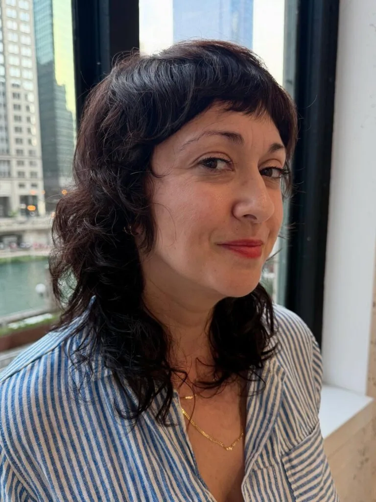 shoulder curly chestnut shag with curly fringe fringe shown as a hairstyles for women over 40 with bangs idea