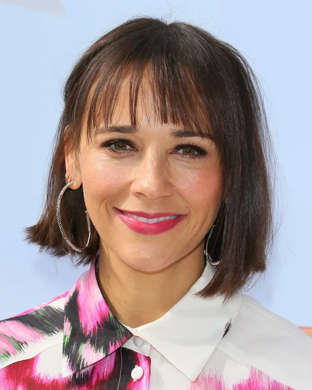 chin straight chestnut bob with wispy fringe shown as a hairstyles for women over 40 with bangs idea