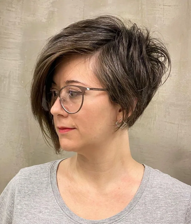 ear straight chestnut pixie with side swept fringe shown as a hairstyles for women over 40 with bangs idea