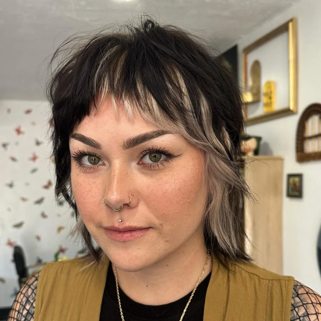 shoulder wavy chestnut shag with curtain fringe shown as a hairstyles for women over 40 with bangs idea, featuring chestnut color
