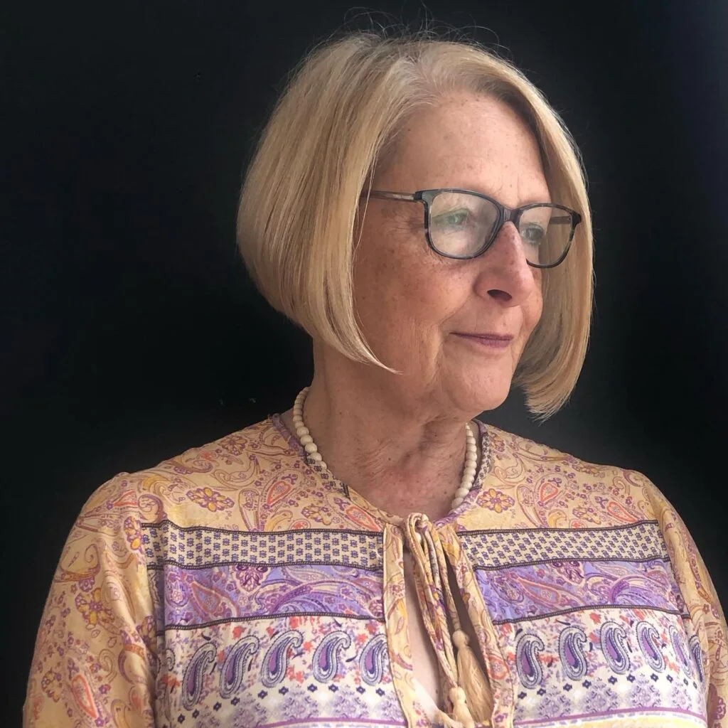 chin straight silver bob shown as a hairstyles for women over 60 idea