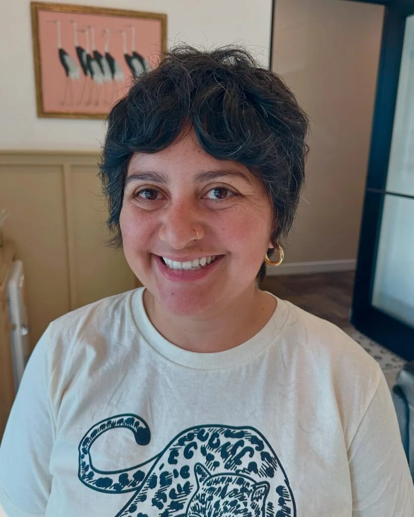 ear straight brunette pixie shown as a hairstyles with bangs for older women idea