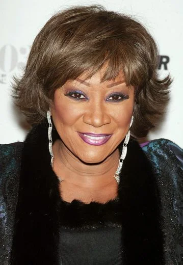 jaw straight chestnut bob with side swept fringe shown as a hairstyles with bangs for older women idea