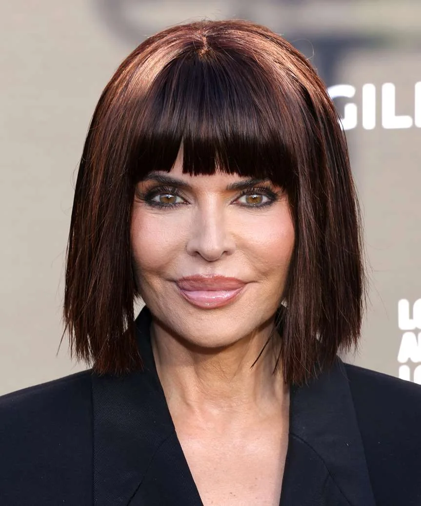 jaw straight chestnut bob with blunt fringe shown as a hairstyles with bangs for older women idea