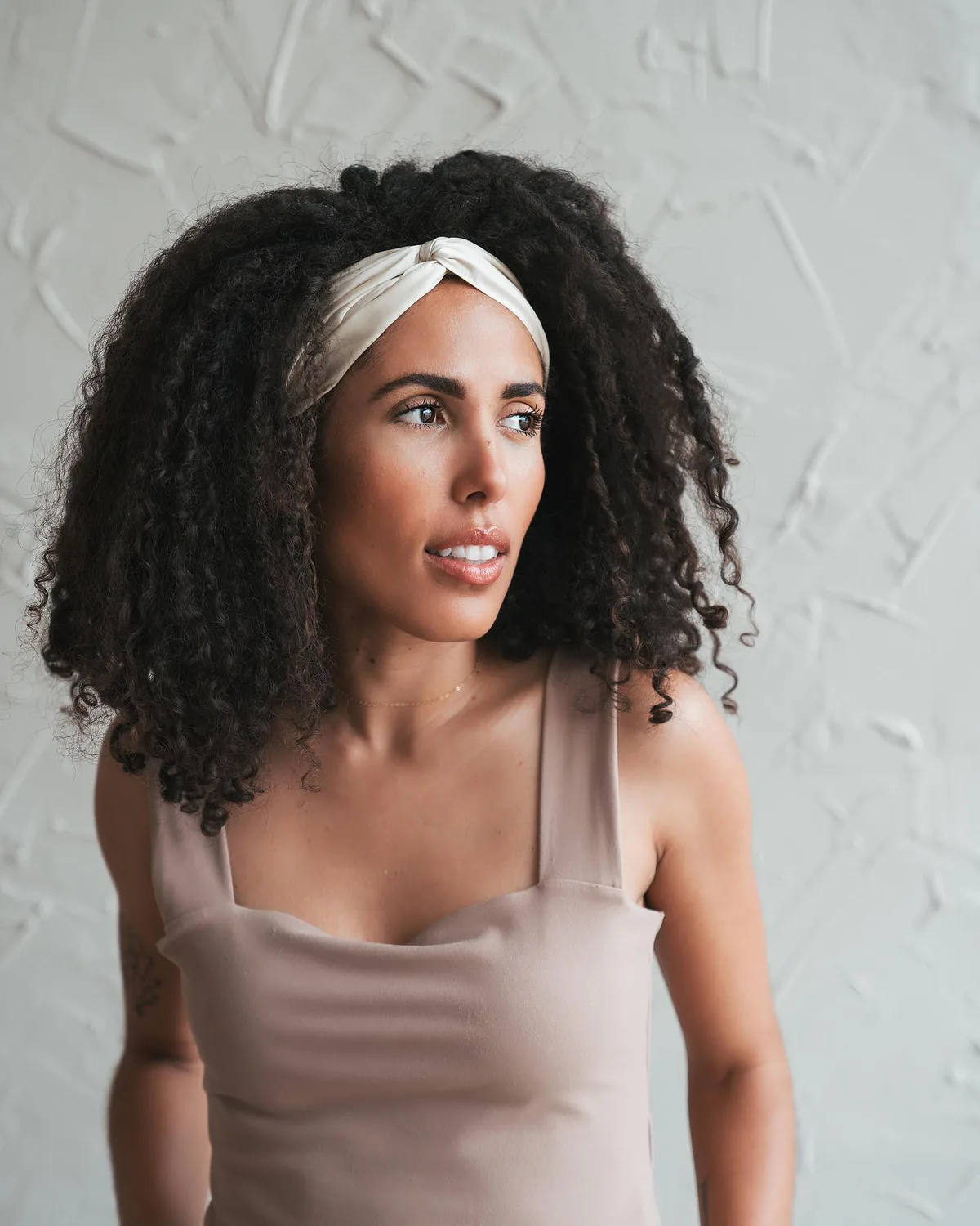 shoulder curly brunette curly style shown as a headband hairstyles idea