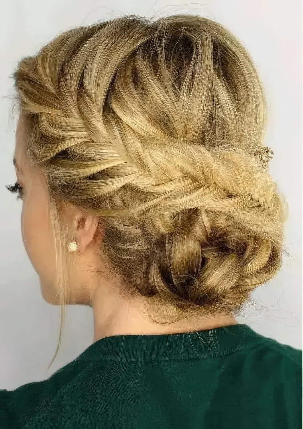 Fishtail side braided updo with a braided bun and some locks down.