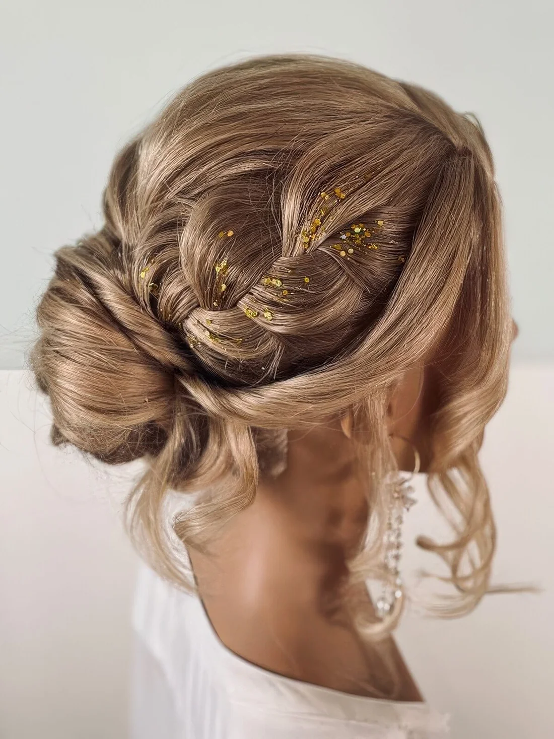Photo showing holiday updo, with the hairstyle clearly visible.