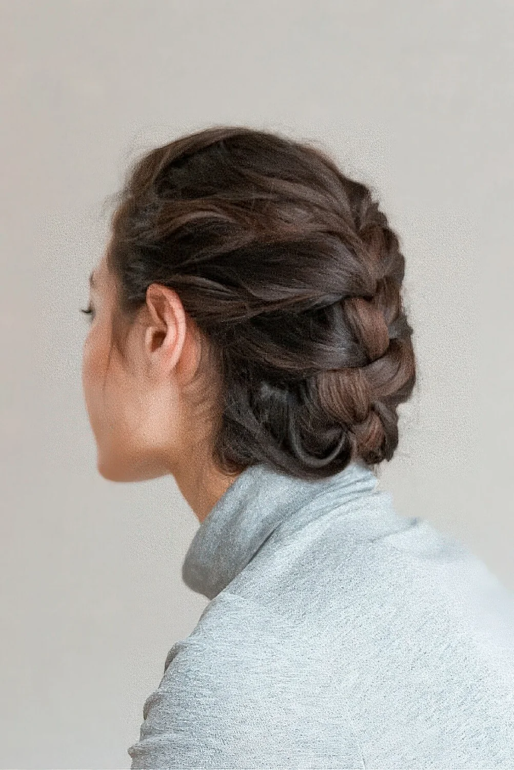 Simple braided low updo with a bump on top.