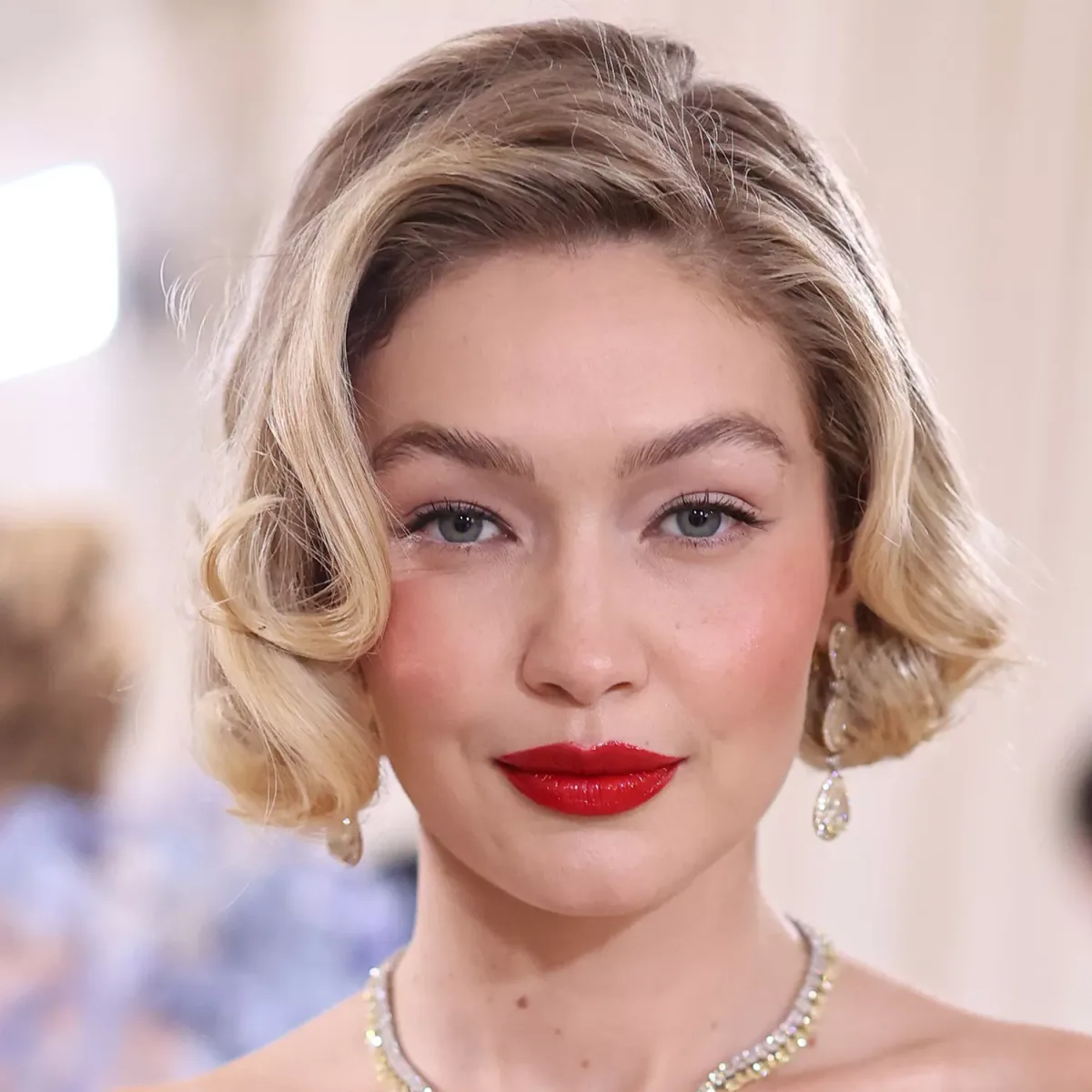 chin wavy blonde bob shown as a hollywood waves idea, featuring glossy finish