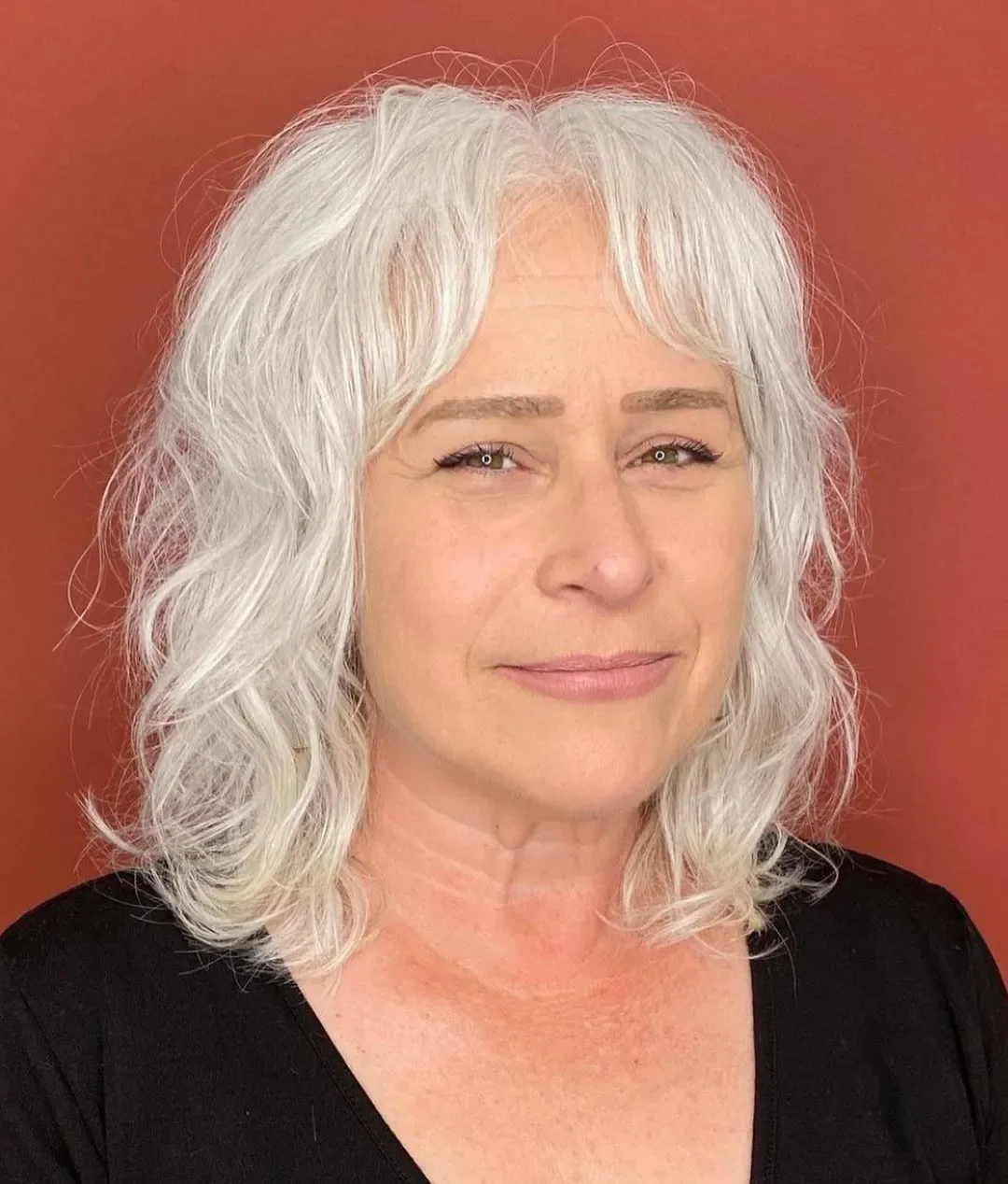 shoulder wavy gray lob shown as a layered bob haircuts for women over 60 idea