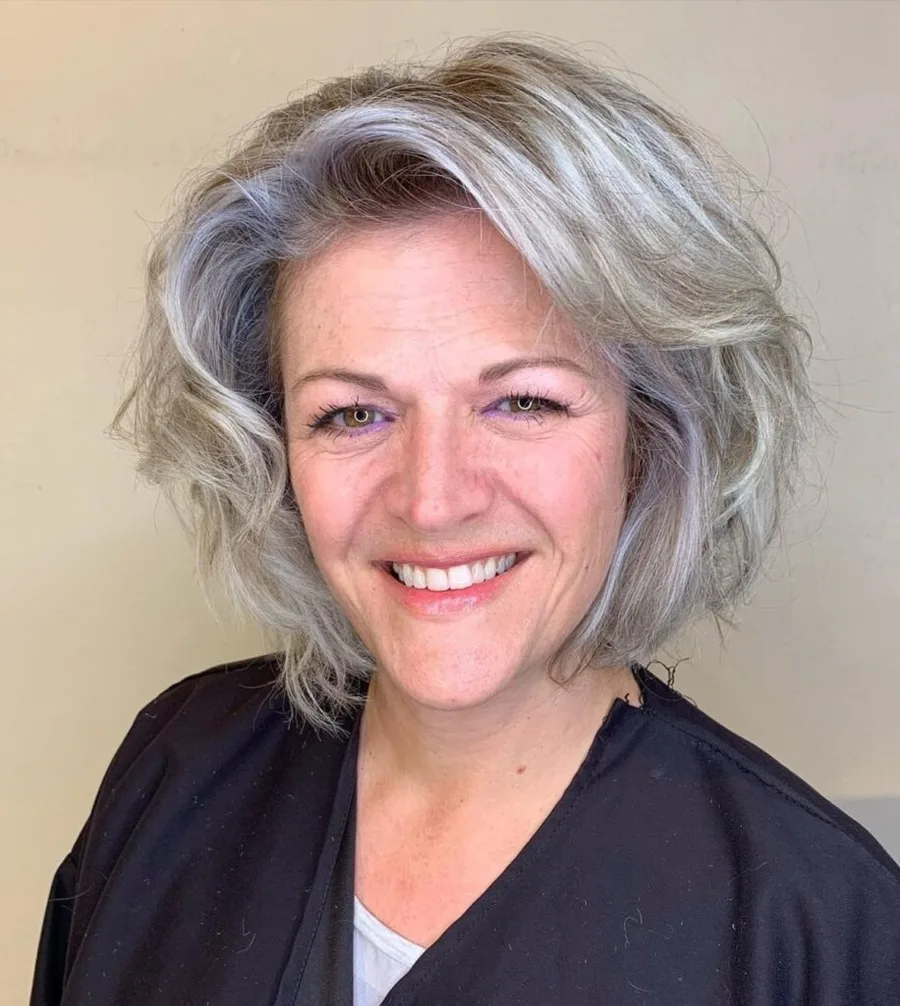 chin wavy silver bob shown as a layered bob hairstyles for older women idea